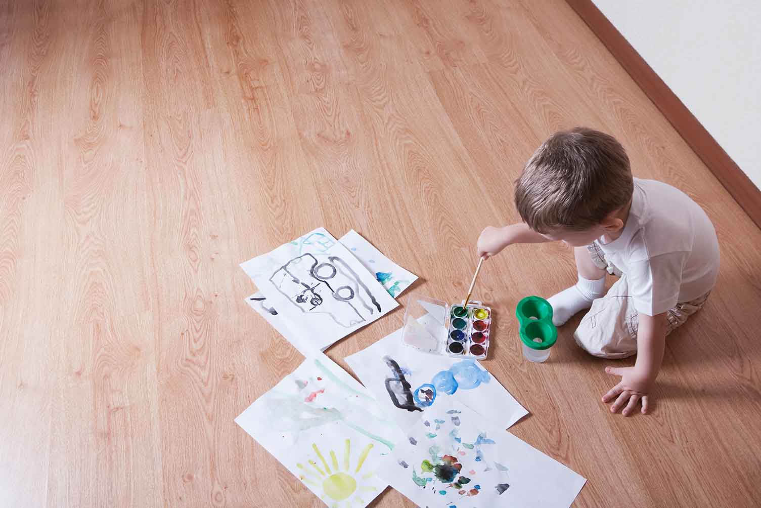 Little boy drawing a picture on the floor | Carpet Plus